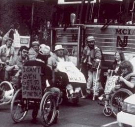 Picture of demonstrators with signs. 
      Select for more details.