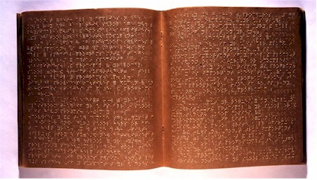 Enlarged image of the Braille book.  
      Description follows.