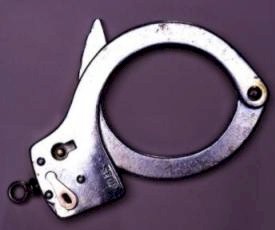 Picture of a cut handcuff. 
      Select this link to get more details of the picture.